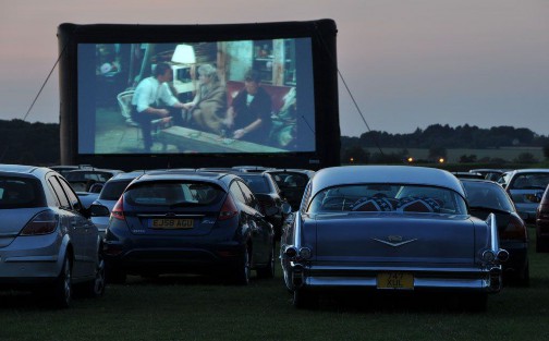 A car in a movie theater  Description automatically generated