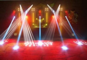 A stage with lights and a stage with a red floor  Description automatically generated with medium confidence