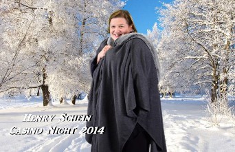 A person in a blanket in a snowy forest  Description automatically generated
